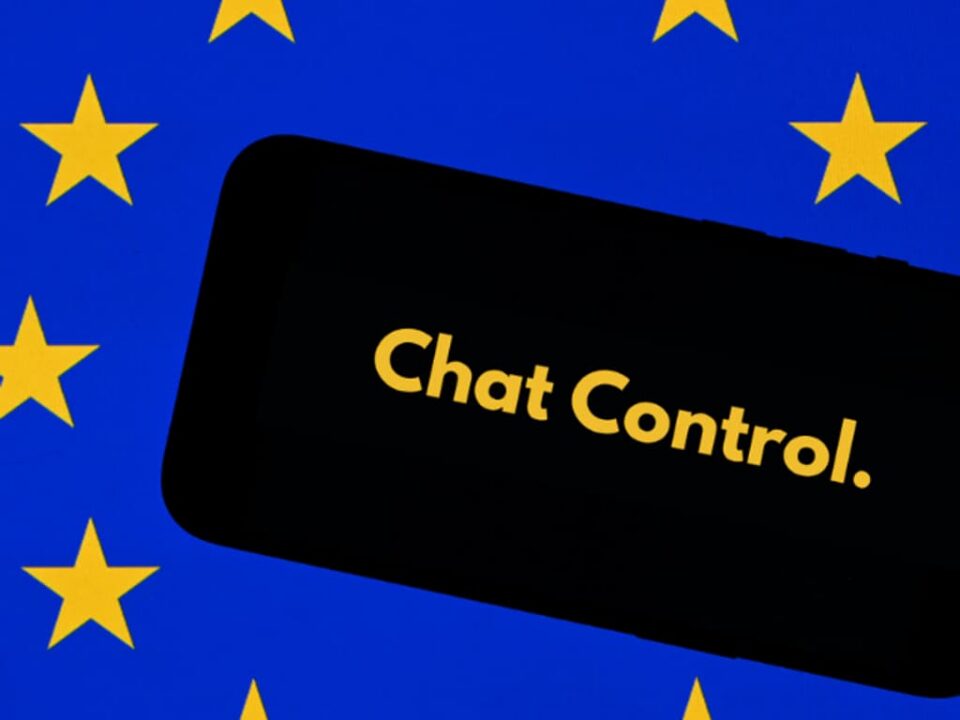 Black smartphone displaying the text "Chat Control" in yellow, set against a blue background with yellow stars evoking the European flag